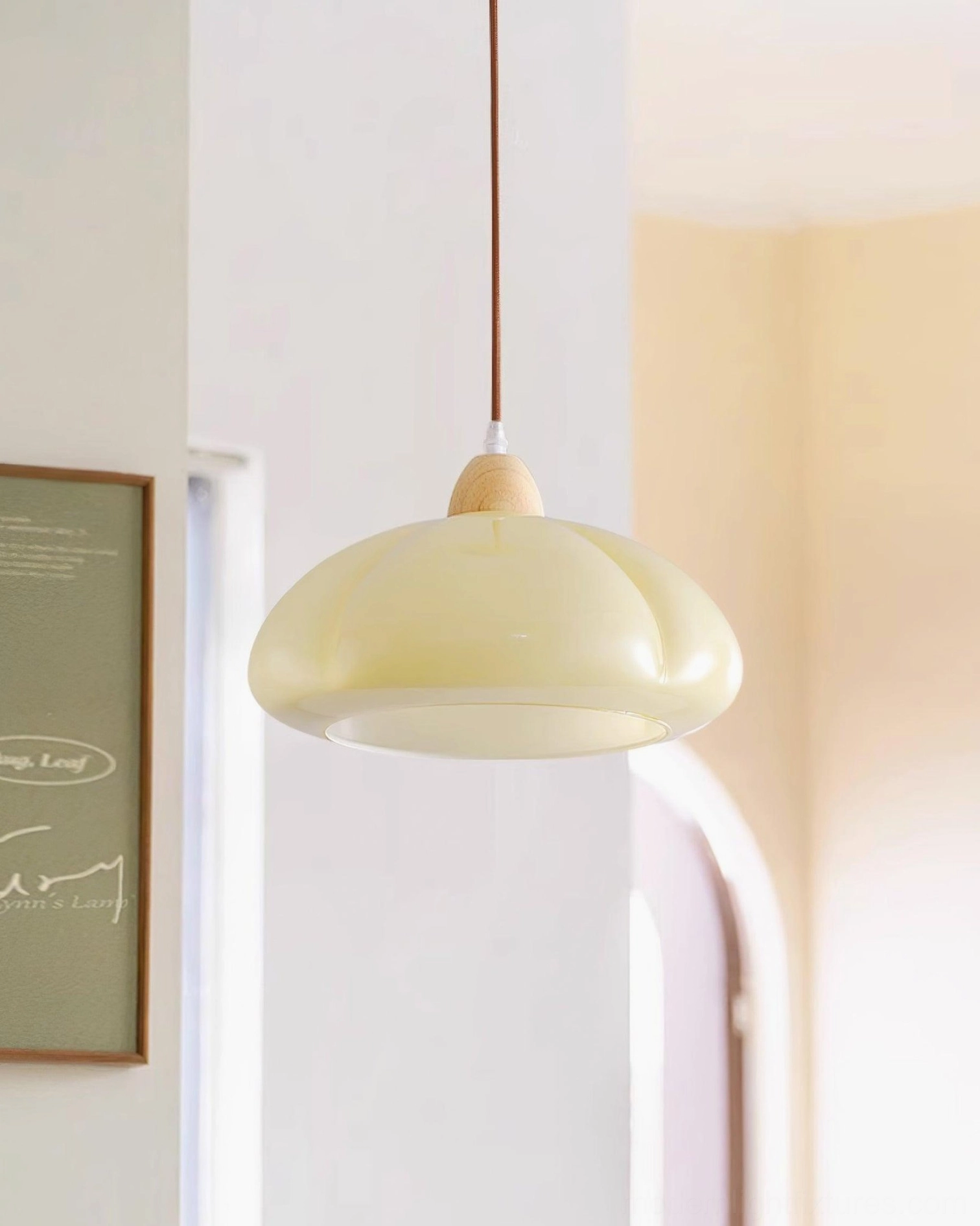 Cipola soft white glass dome pendant lamp in bright cheerful dining area interior
