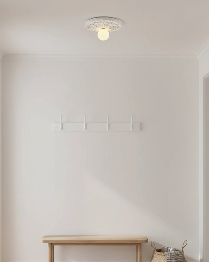 Circa black embossed ceiling light fixture featuring intricately carved relief design detail