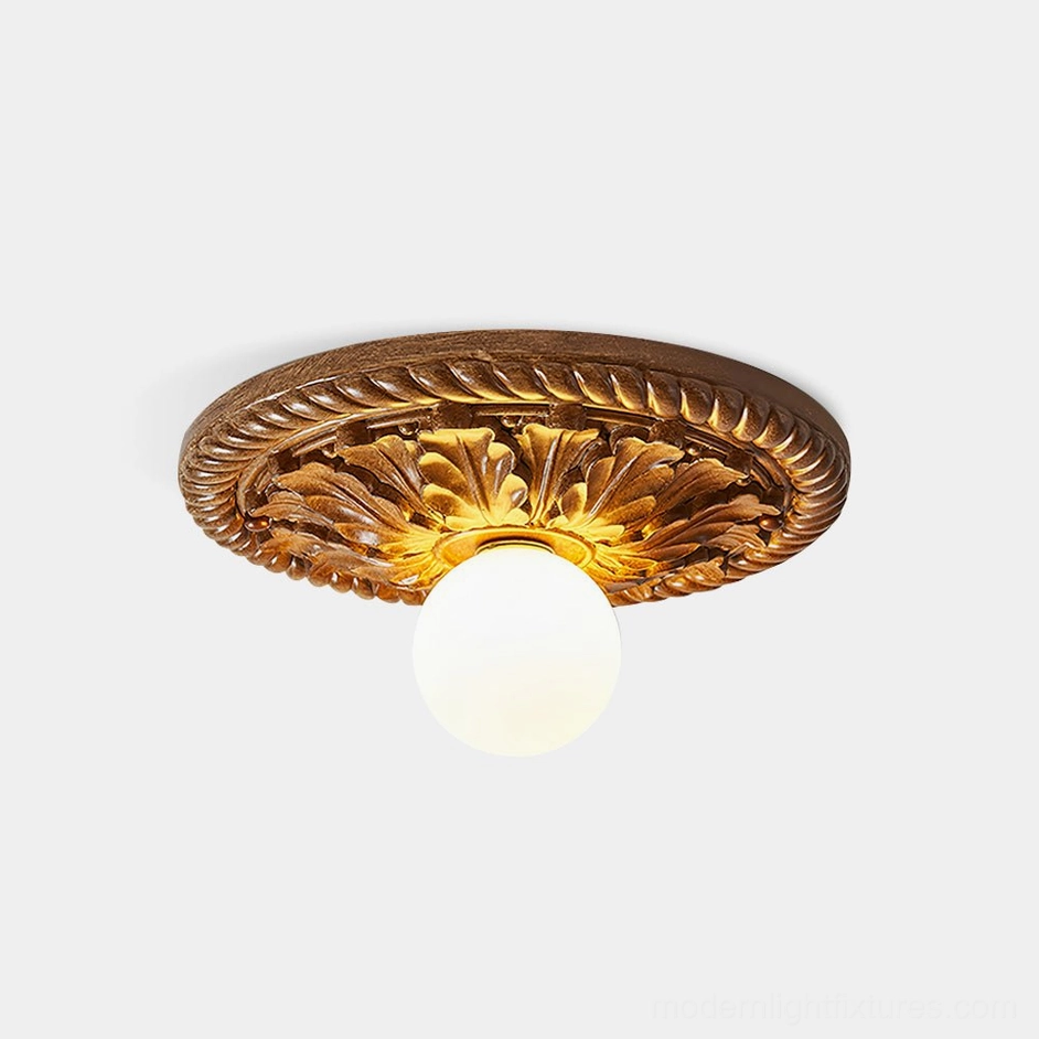 Circa embossed ceiling light fixture with French neoclassical relief design, front overhead view on white backdrop