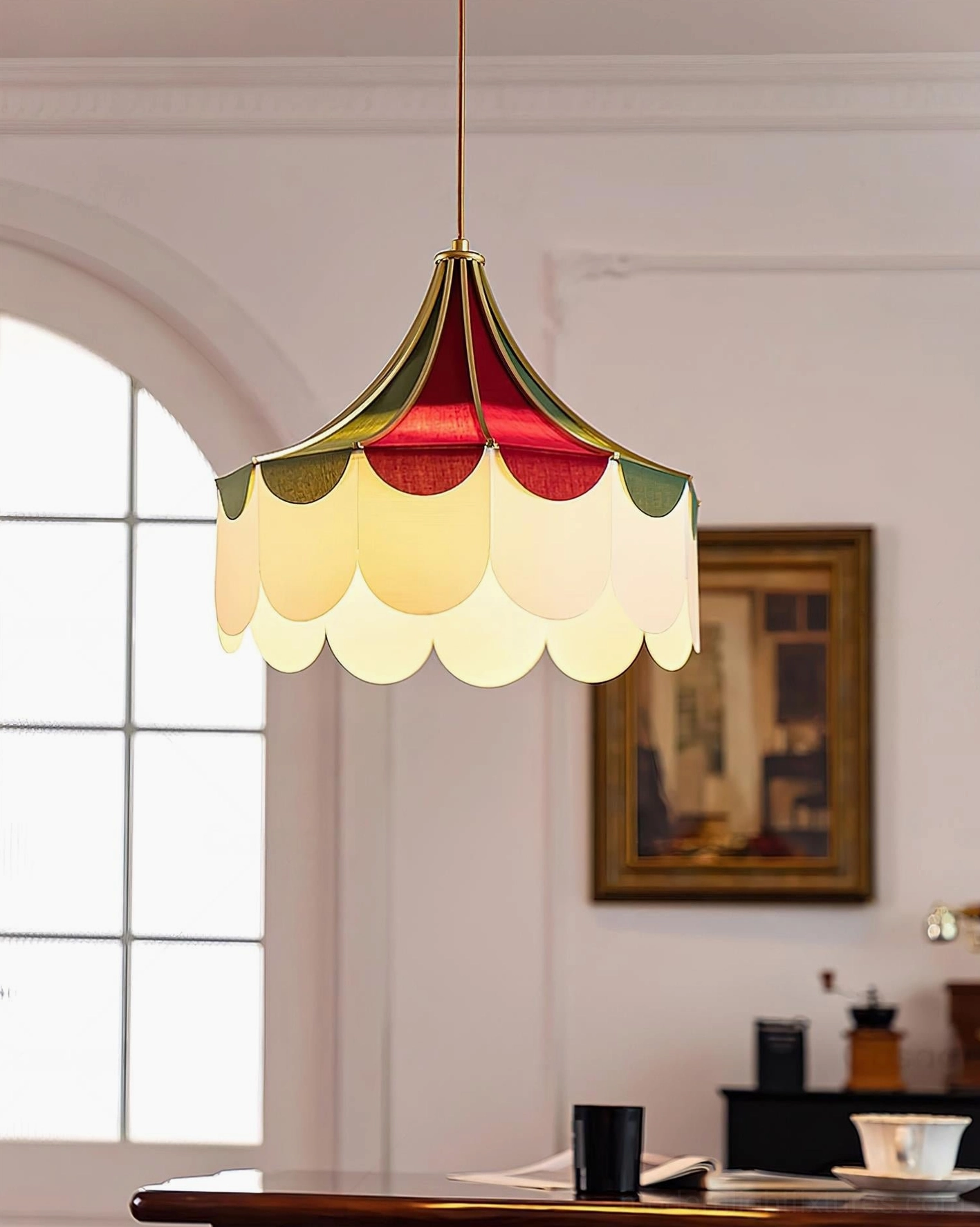 Retro scalloped fabric pendant lamp in dining room with arched window creating warm vintage home lighting ambiance