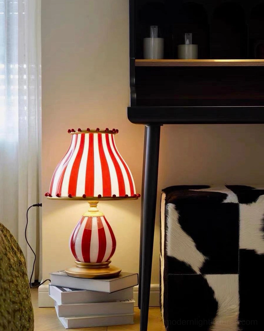 Circus table lamp with clown costume inspired pom-pom shade decoration