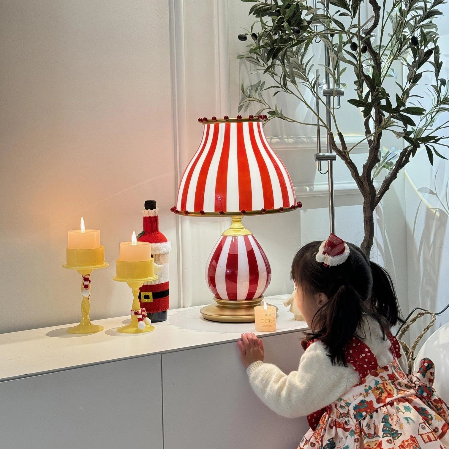 Circus table lamp creating festive ambiance in eclectic home decor setting