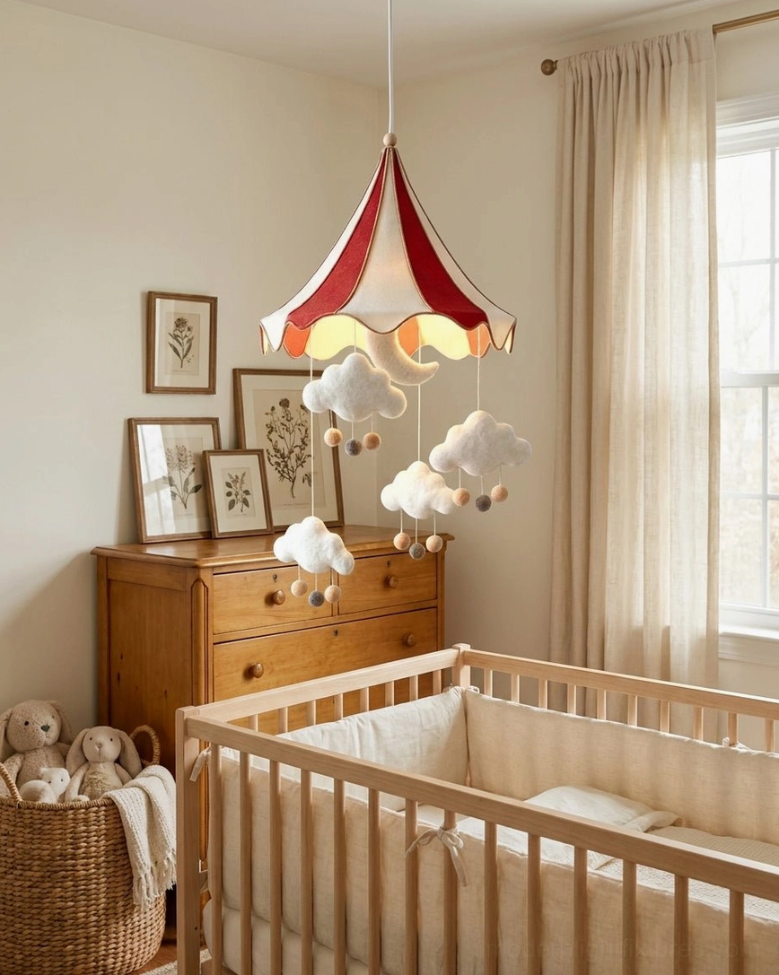 Striped fabric tent pendant hanging above wooden crib in traditional Scandinavian nursery with dresser