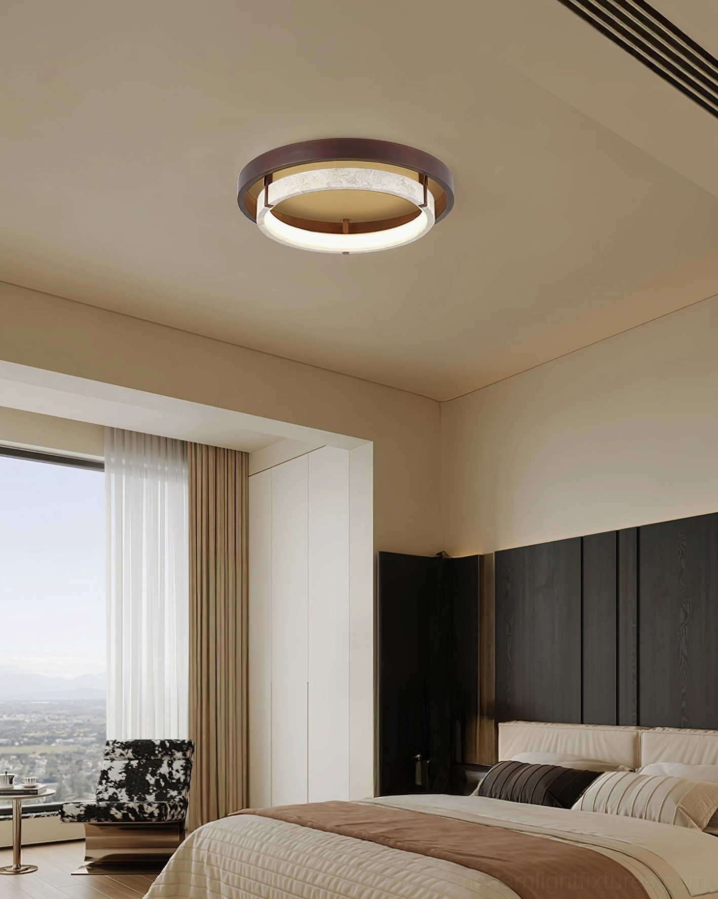 Cirvela ceiling light installed in luxury master bedroom, overhead perspective showing warm neutral decor integration
