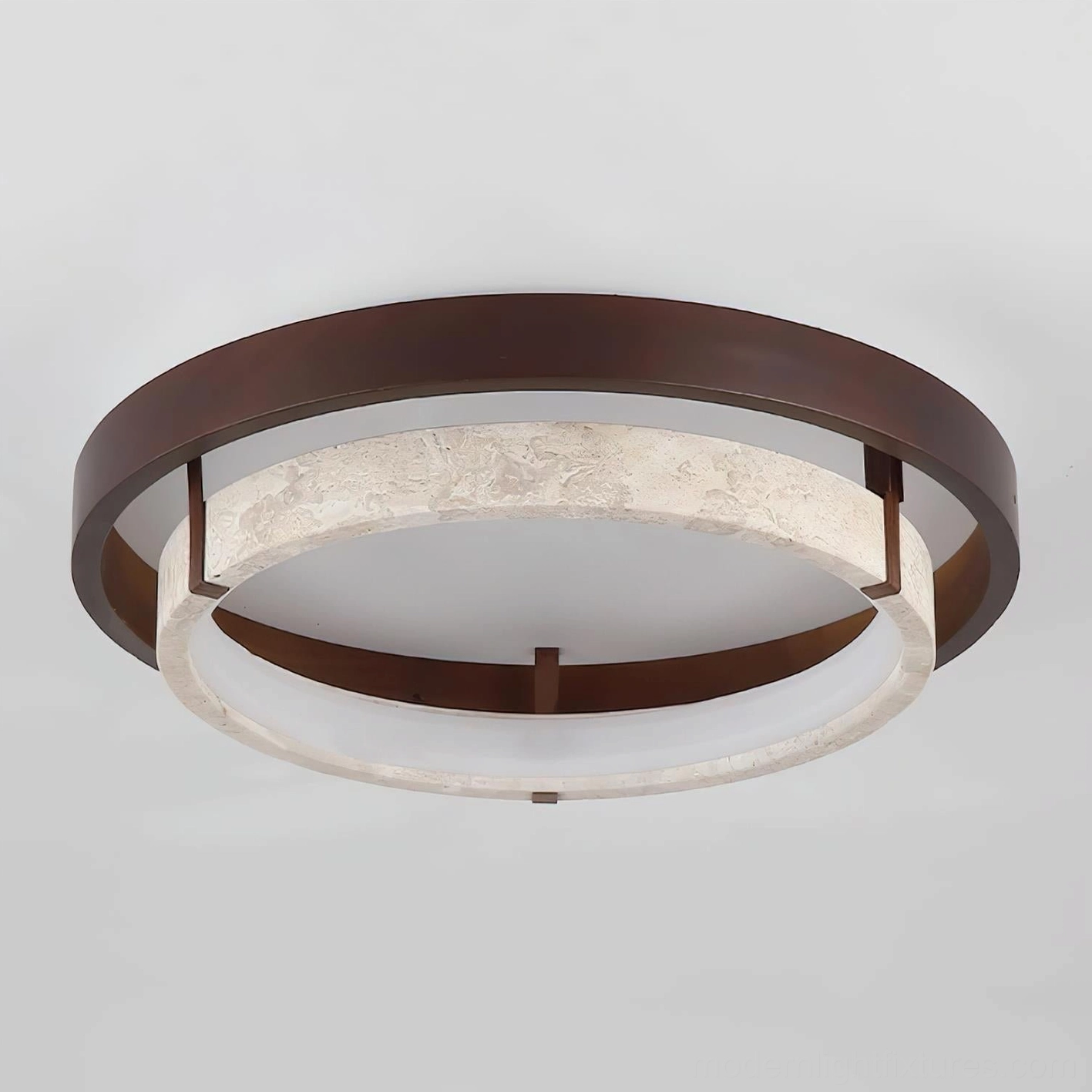 Cirvela travertine ceiling light, close-up view of warm metal frame and natural stone body composition