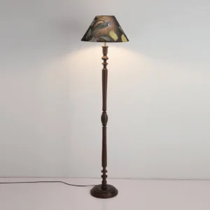 Illuminated Citrina floor lamp in interior setting emitting warm ambient light