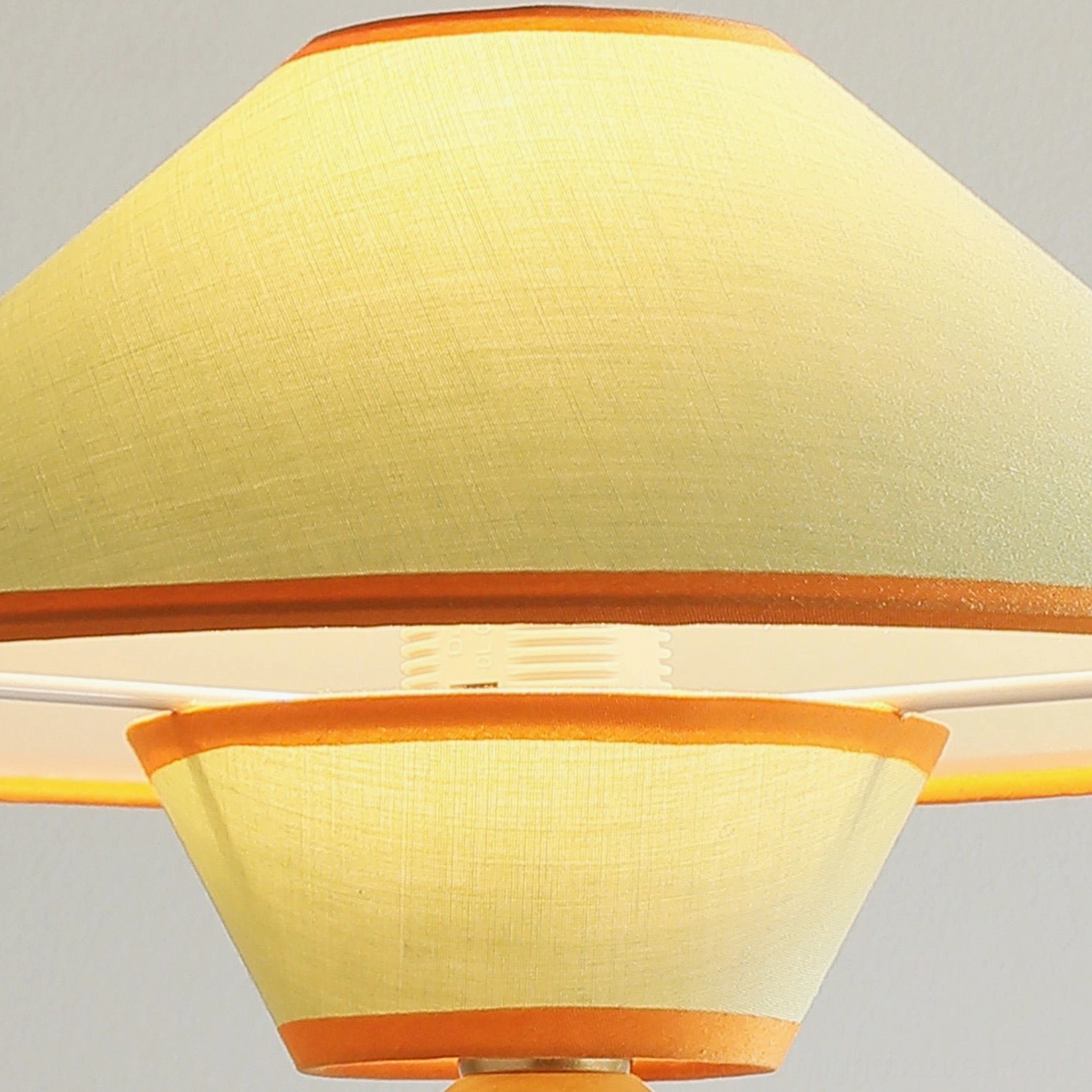 Contemporary dome table lamp with warm wood construction and soft fabric shade for bedroom or reading nook lighting