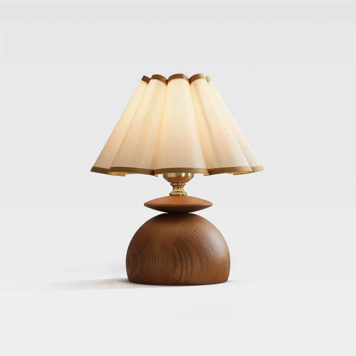 Modern pleated beige fabric dome table lamp with brushed gold metal hardware and solid wood base detail