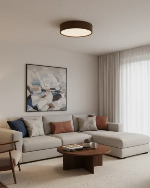 Clara flush mount ceiling light installed in neutral living room, eye-level perspective showing soft ambient glow