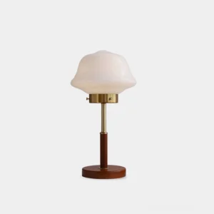 Clara mid-century modern table lamp with mushroom opal glass shade, walnut wood base, and brushed brass stand on white background