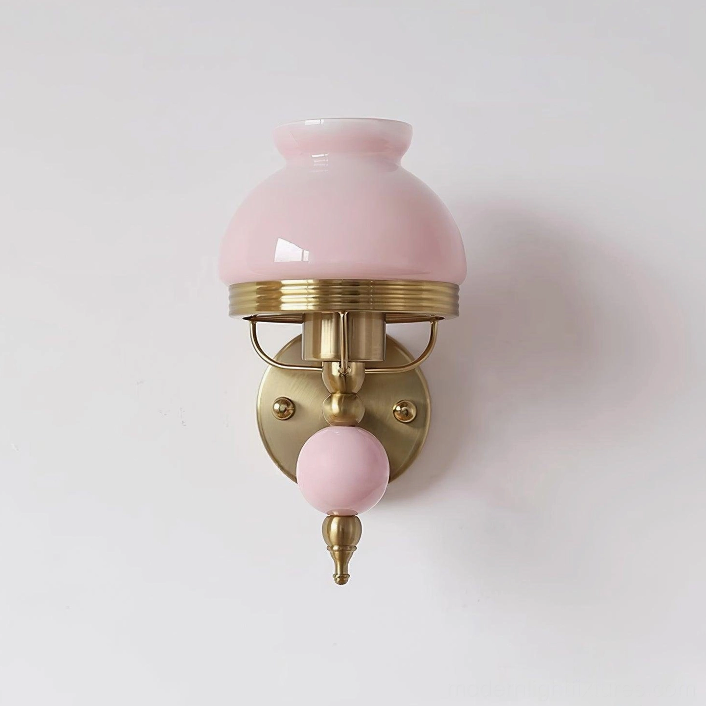 Classic retro floral wall sconce showing warm brass finish and frosted glass design