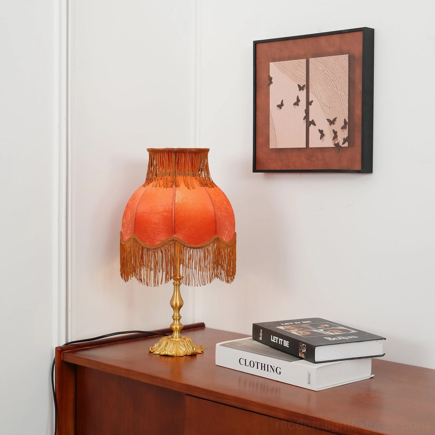 Classic handmade tassel table lamp with fringe-trimmed shade and brass base ambiance