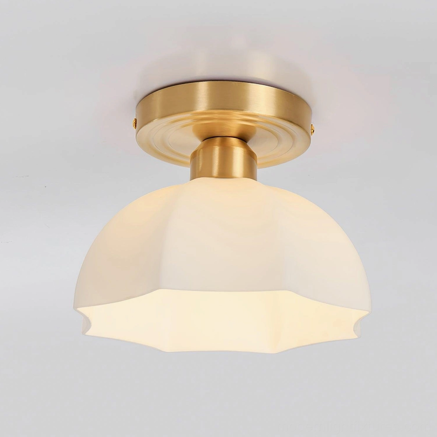 Scalloped semi-flush brass ceiling light fixture displaying classic vintage mid-century design elements