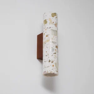 Modern terrazzo wall lamp angled perspective showing cylindrical shade texture and open-bottom design