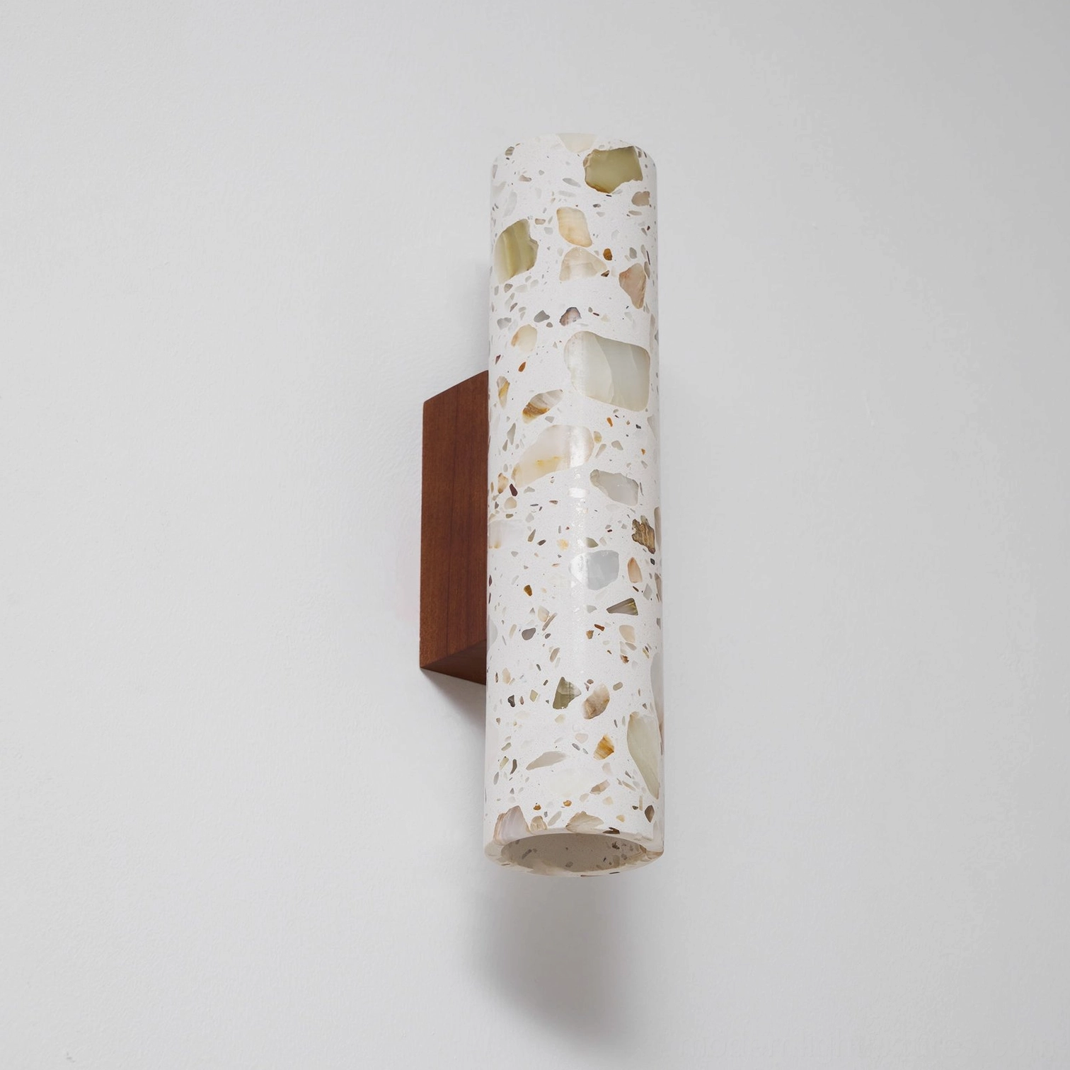 Modern terrazzo wall lamp angled perspective showing cylindrical shade texture and open-bottom design