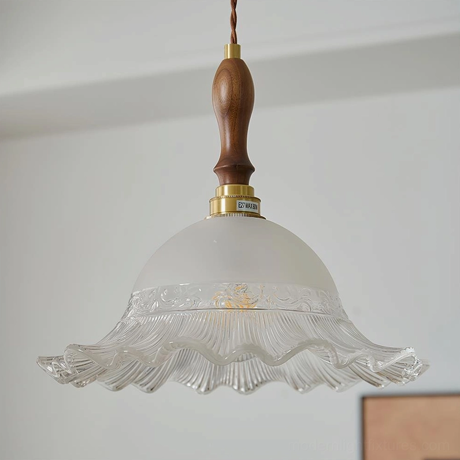Clear frosted glass pendant light with scalloped edge and vintage brass detail