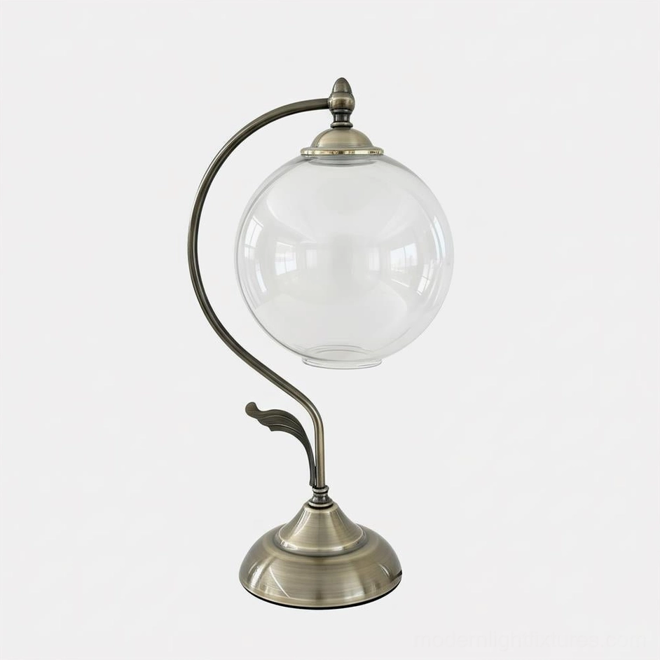 Clear glass celestial globe table lamp with brass curved arm, neutral minimalist design showing product form and structure