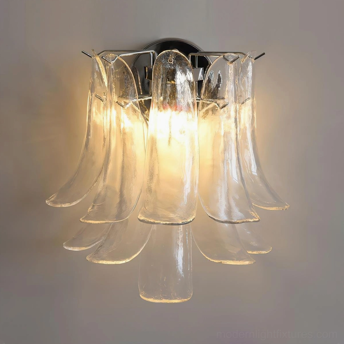Clear glass petal wall sconce, transparent handcrafted petal design revealing intricate sculpted details and chrome framework