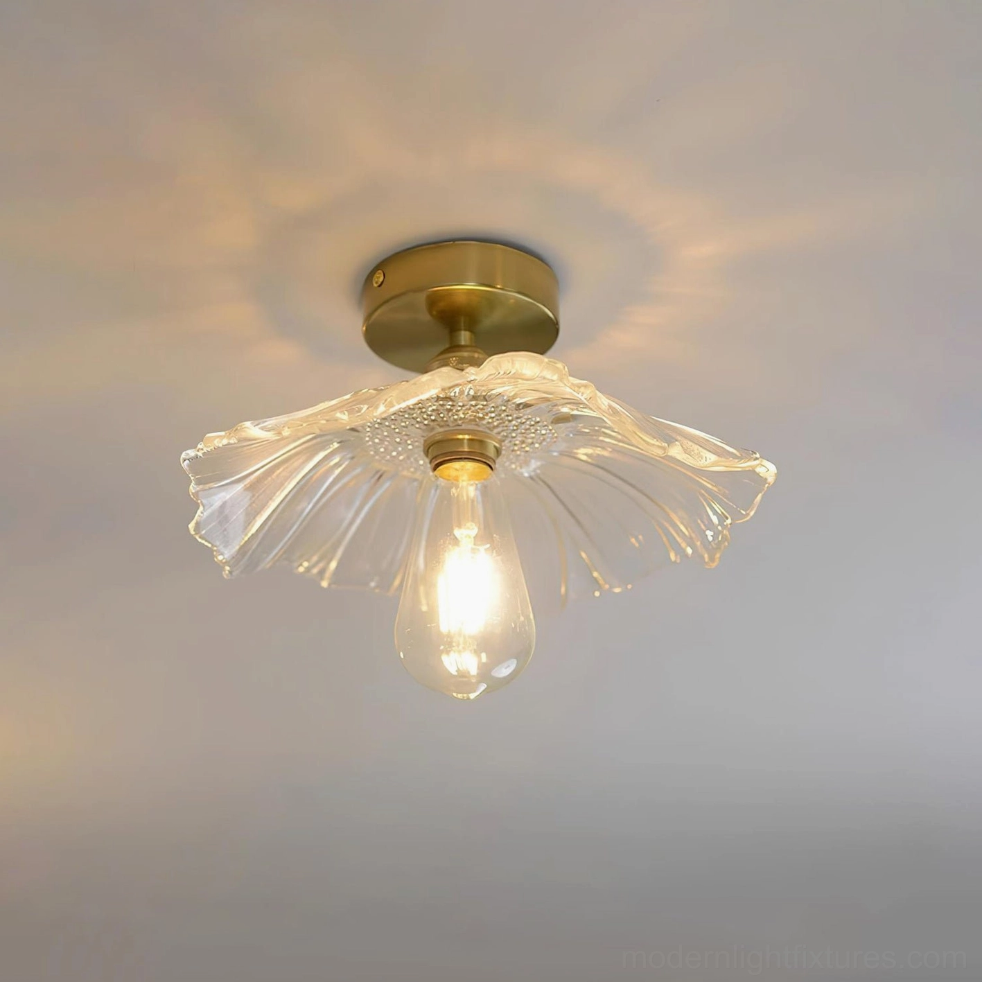 Clear glass Kinney semi-flush ceiling light fixture in contemporary bedroom setting