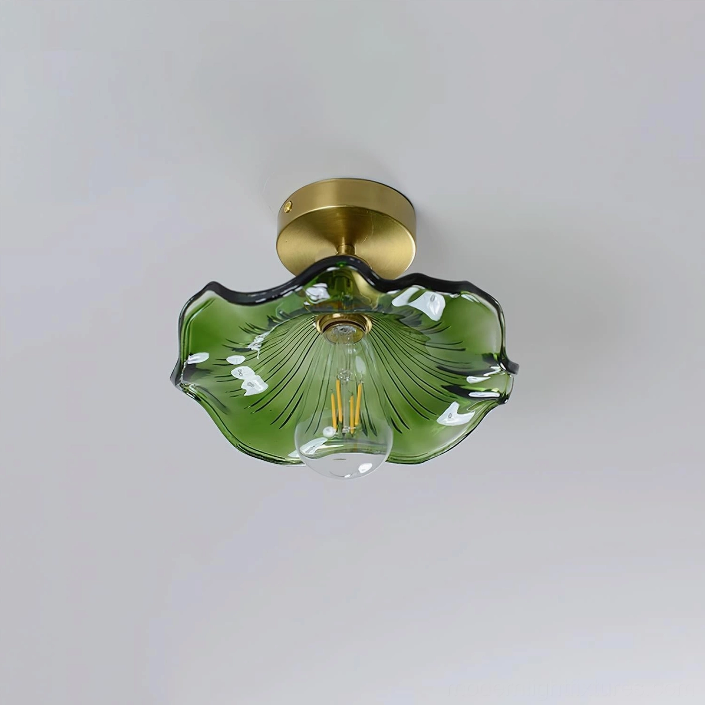 Clear ruffled glass semi-flush ceiling light with brass gold base and Edison-style exposed bulb