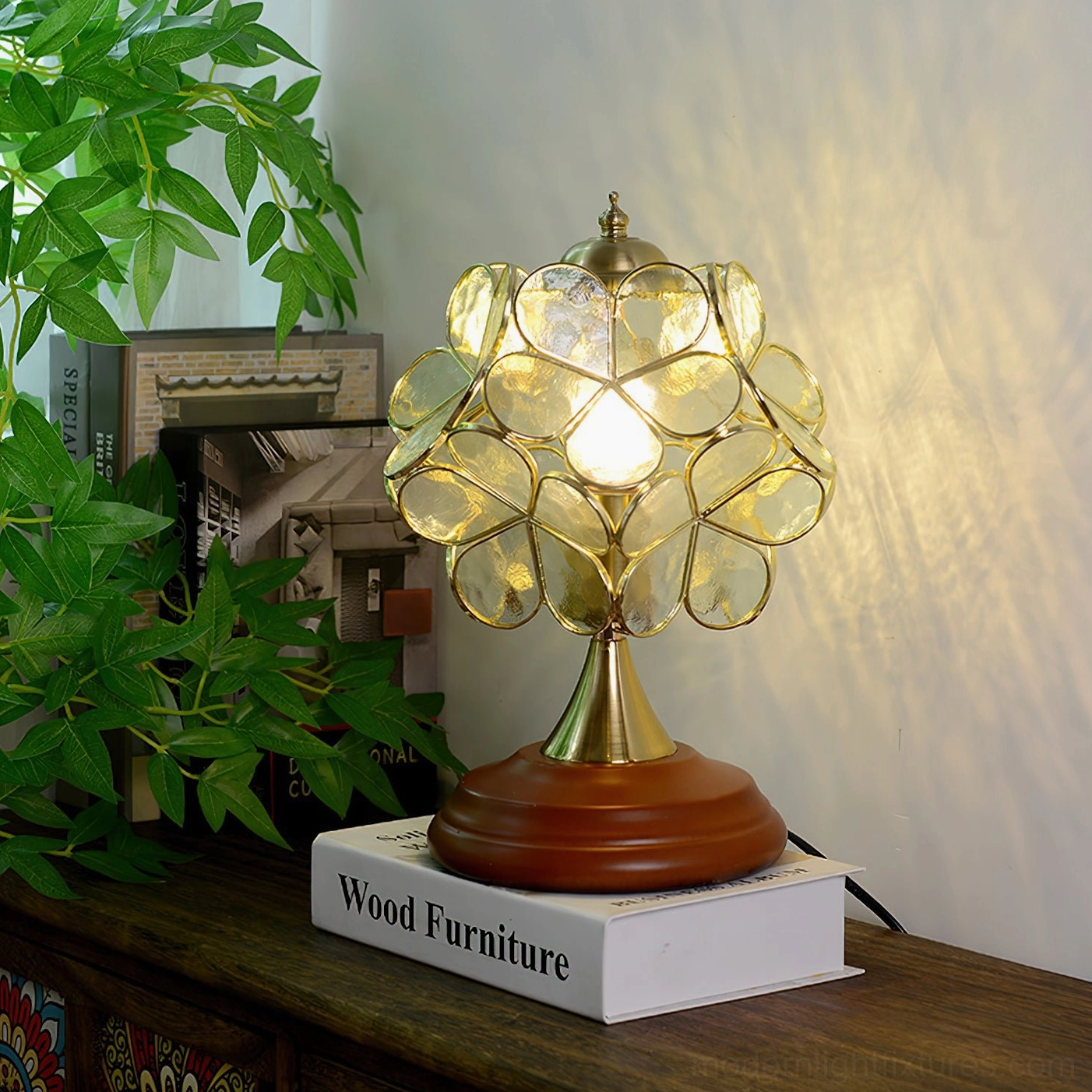 Clear transparent stained glass Tiffany table lamp with warm illumination on wooden side table