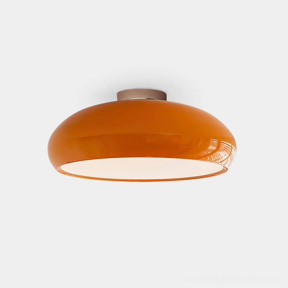 Clementine modern flush mount ceiling light - orange glossy disc shade with silver chrome mounting base, studio product view