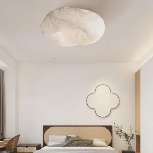 Cream colored fabric ceiling lamp in minimalist bedroom interior design