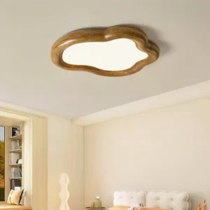 Brown wood-frame cloud ceiling light fixture installed on bedroom ceiling with warm ambient lighting from above