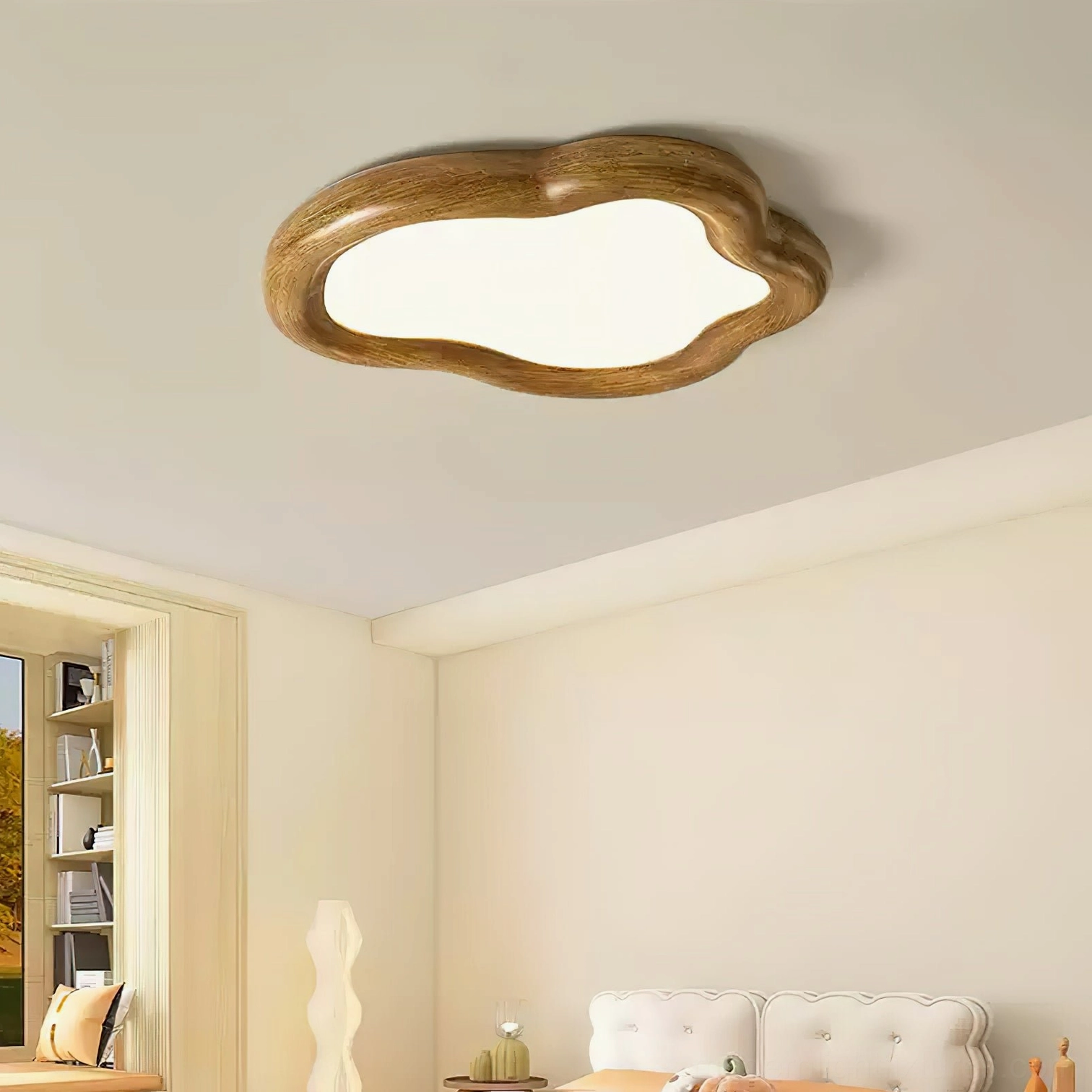 Brown wood-frame cloud ceiling light fixture installed on bedroom ceiling with warm ambient lighting from above