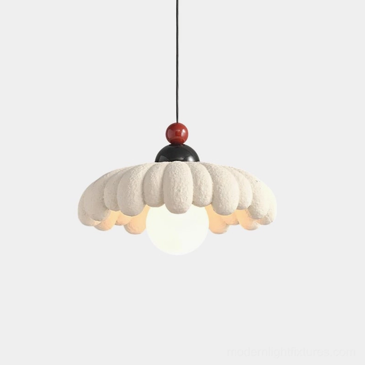 Cloudet sculptural pendant lamp with scalloped white fabric shade and decorative metal top, front view on plain background