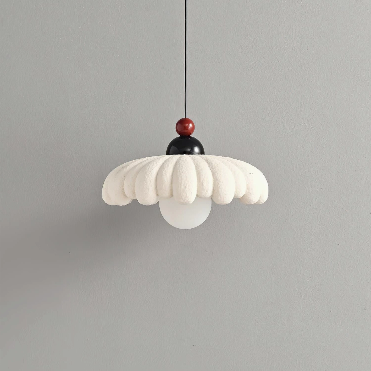 Modern cloudet pendant lamp design from side angle, artistic organic silhouette with textured fabric shade
