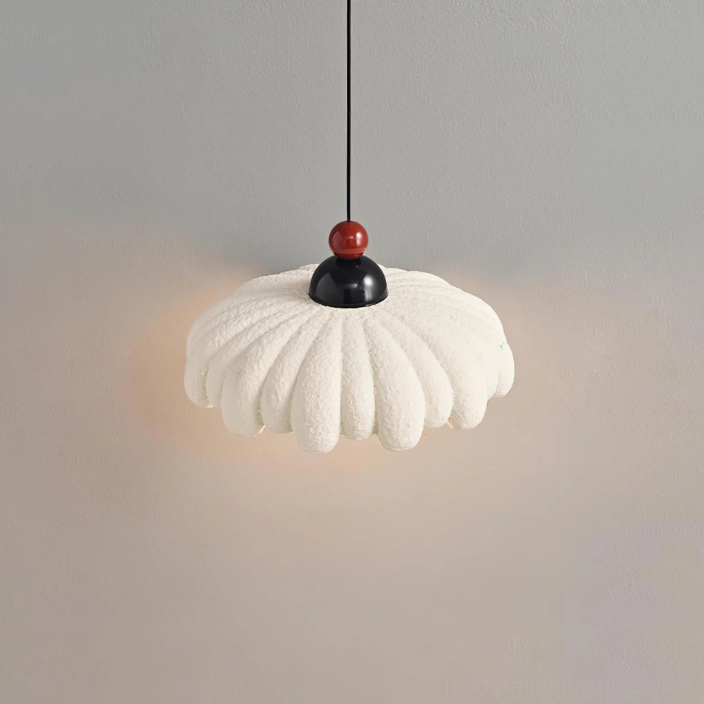 Unlit cloudet pendant lamp close-up, white textured scalloped fabric shade detail, modern sculptural design