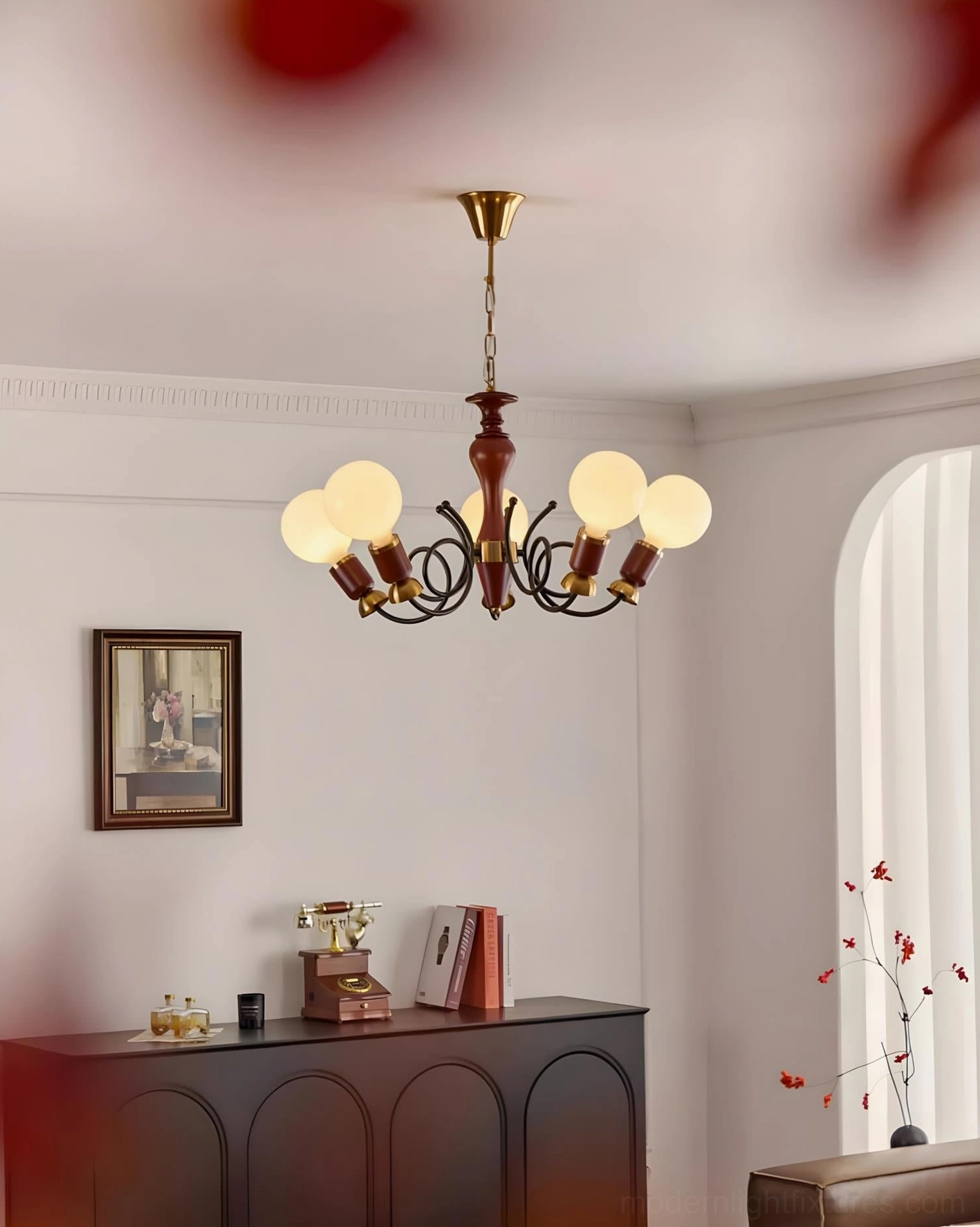 Six-arm cluster pendant in cozy vintage lounge corner with dark wood sideboard