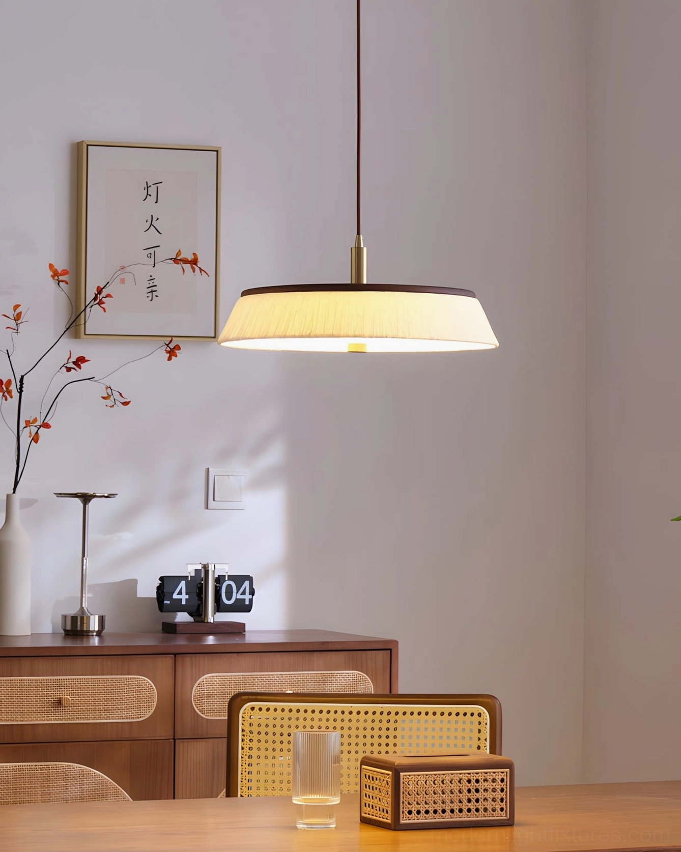 Multiple clustered rice paper pendant lights over long kitchen island, layered ambient lighting solution