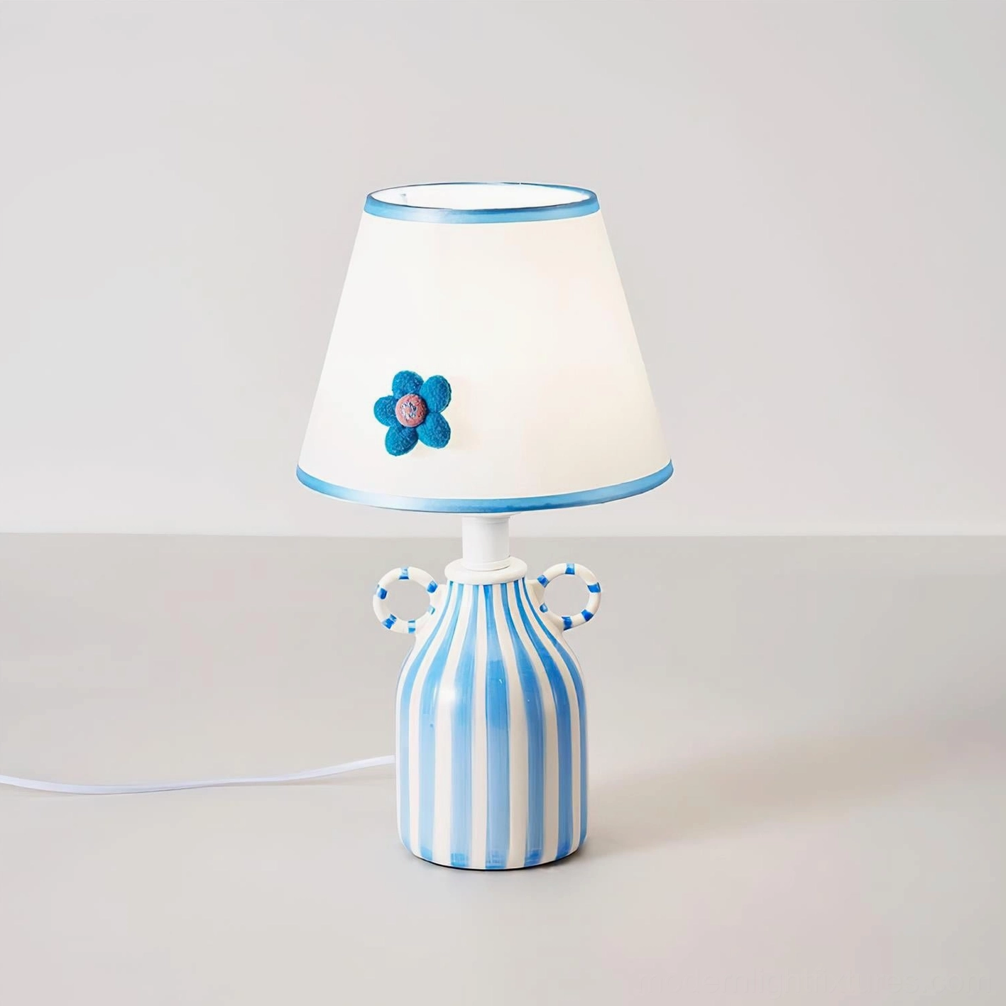 Ceramic table lamp with sculptural felt flower and striped ceramic base - coastal home decor styling