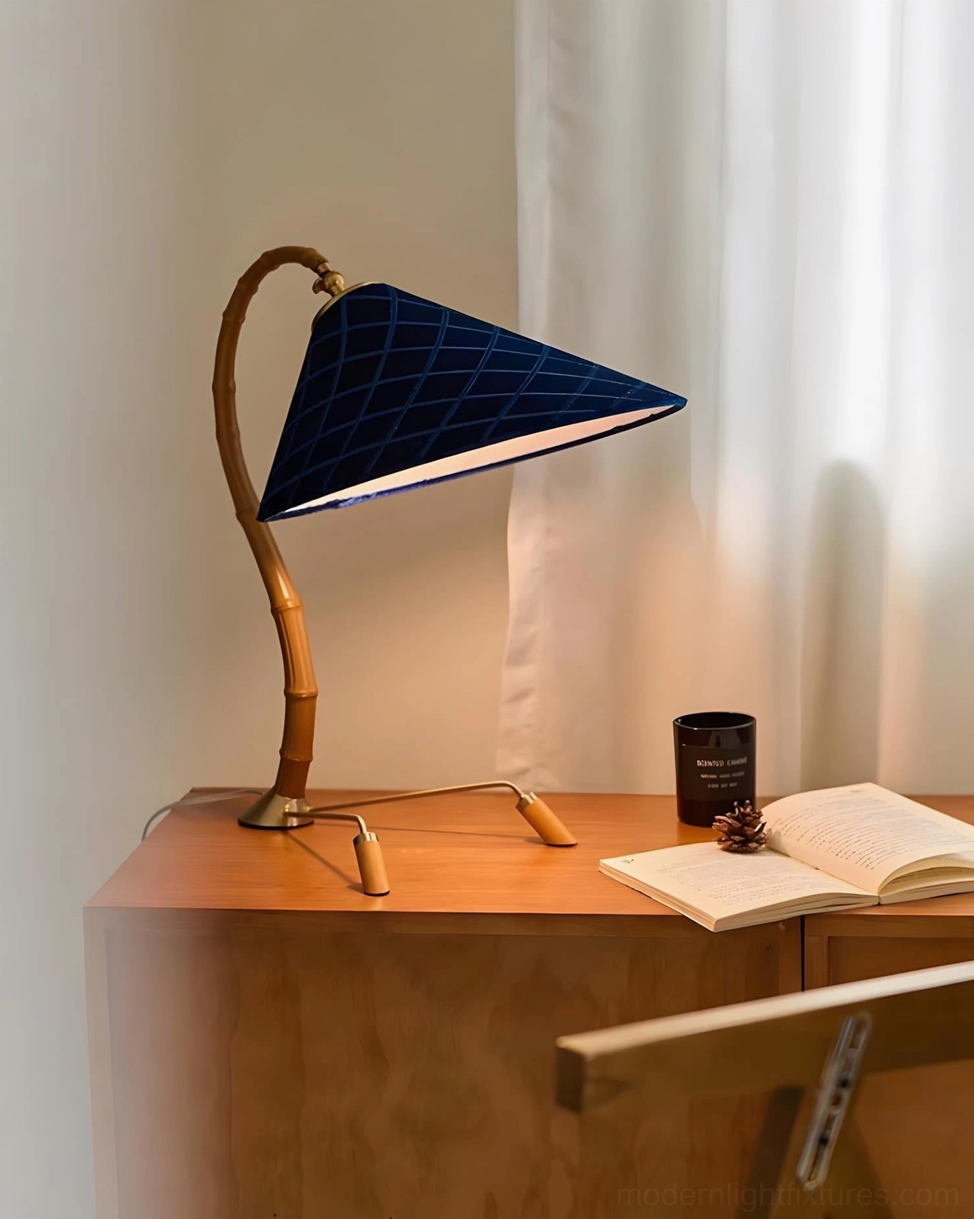 Cobalune modern lamp three-quarter view on wooden dresser vanity in warm bedroom setting