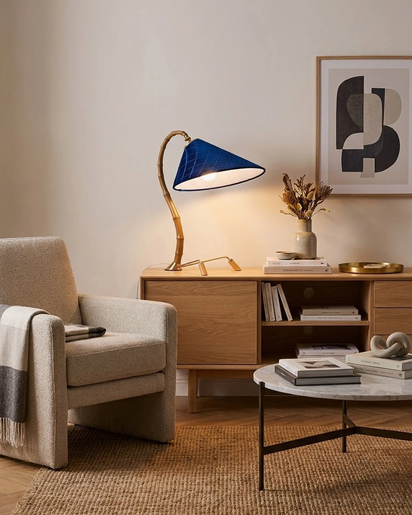 Cobalune table lamp wide side profile on mid-century modern wooden sideboard with minimalist decor