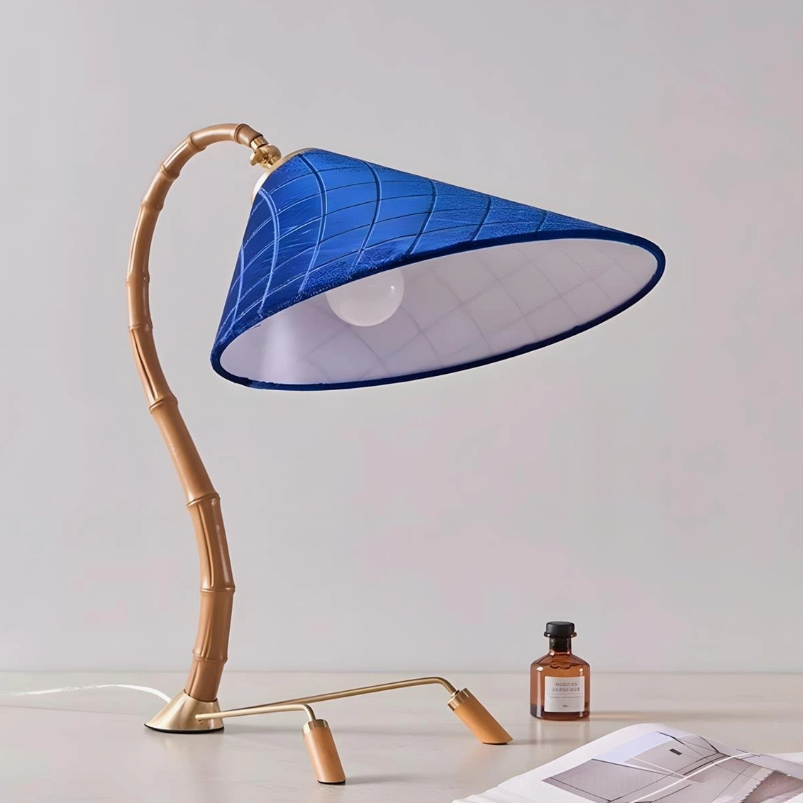 Cobalune bamboo-inspired desk lamp complete view in neutral setting wood look blue color variant