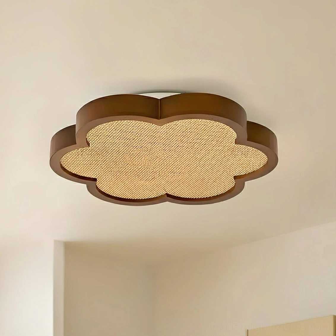 Quatrefoil wood and rattan ceiling lamp against minimalist neutral wall with low-angle perspective