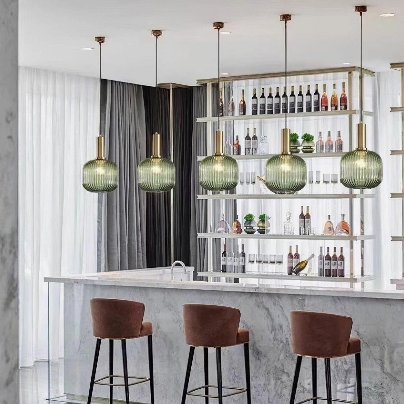 Cognac and smoke gray ribbed glass pendants paired in modern interior showing color coordination and design harmony