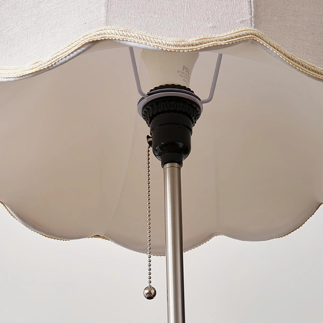 Colette floor lamp detailed view of scalloped fabric shade construction and elegant metal pole design