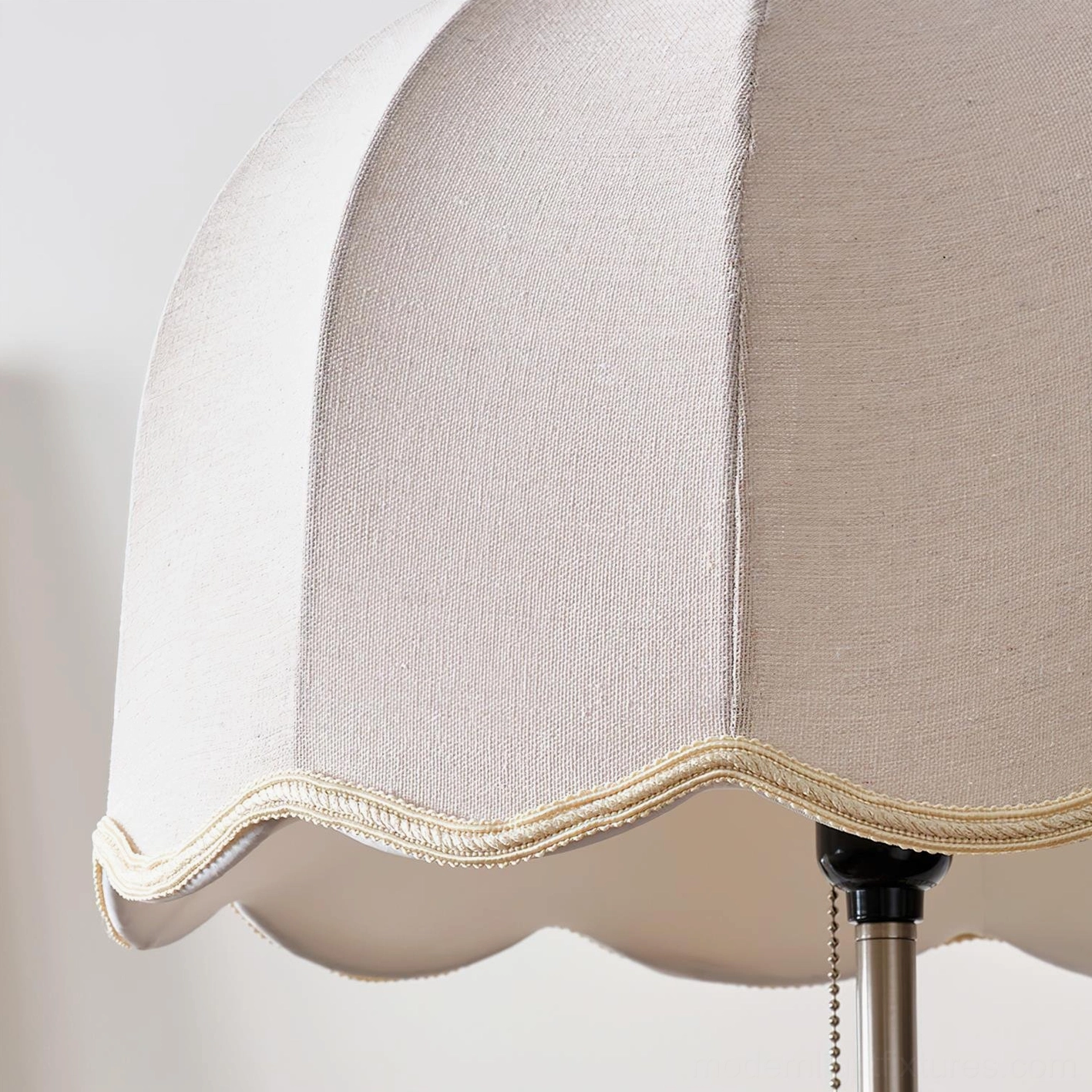 Colette floor lamp with scalloped shade providing soft ambient lighting in contemporary living room interior