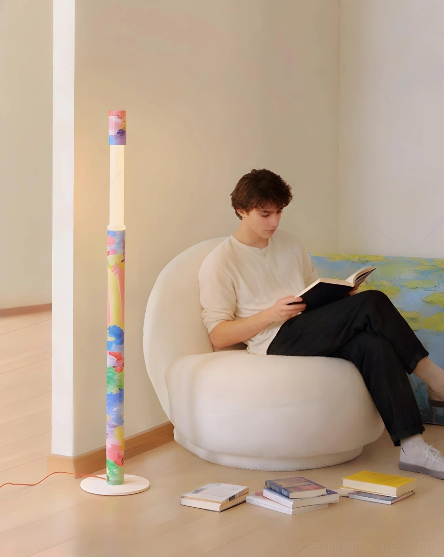 Colorbeam multicolor floor lamp in modern living room beside white lounge chair, side angle showing painted pattern and reading scene styling