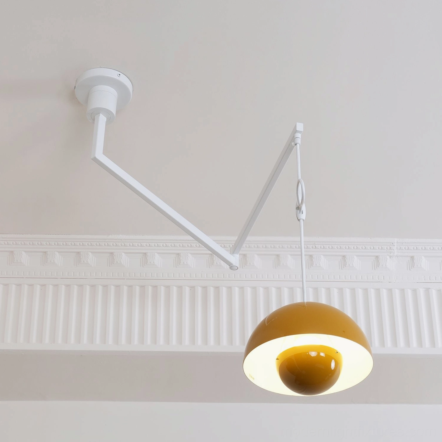 Colored dome pendant light with adjustable arm mechanism studio product shot