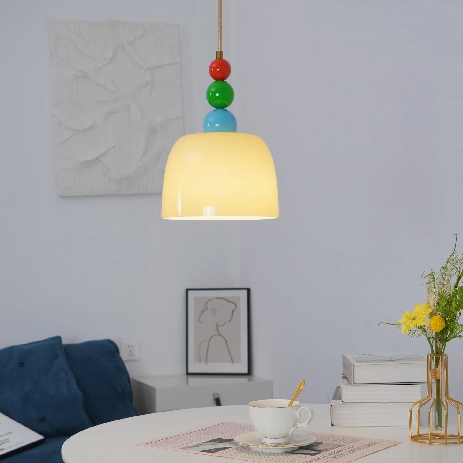 Colorful beaded hanging lamp with hemp rope suspension in contemporary home setting