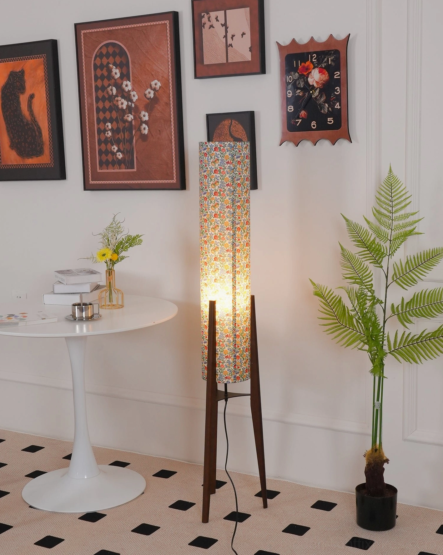 Colorful floral print fabric shade floor lamp showing pattern and glow quality wooden tripod base support
