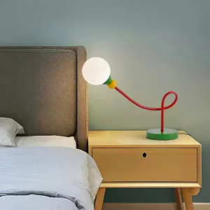 Contemporary G9 table lamp on bedroom nightstand next to fabric headboard for warm accent lighting