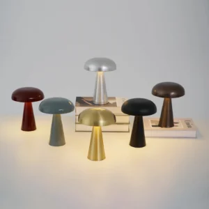 Como cordless table lamp in six aluminum color finishes displayed together - gold, silver, black, gray-blue, red, copper