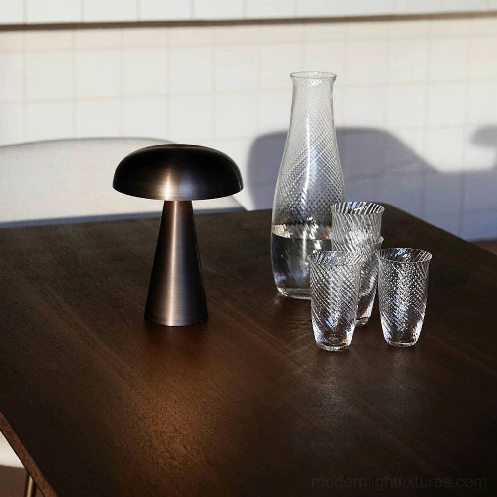 Como cordless table lamp on bedroom nightstand with warm light creating relaxing evening ambiance
