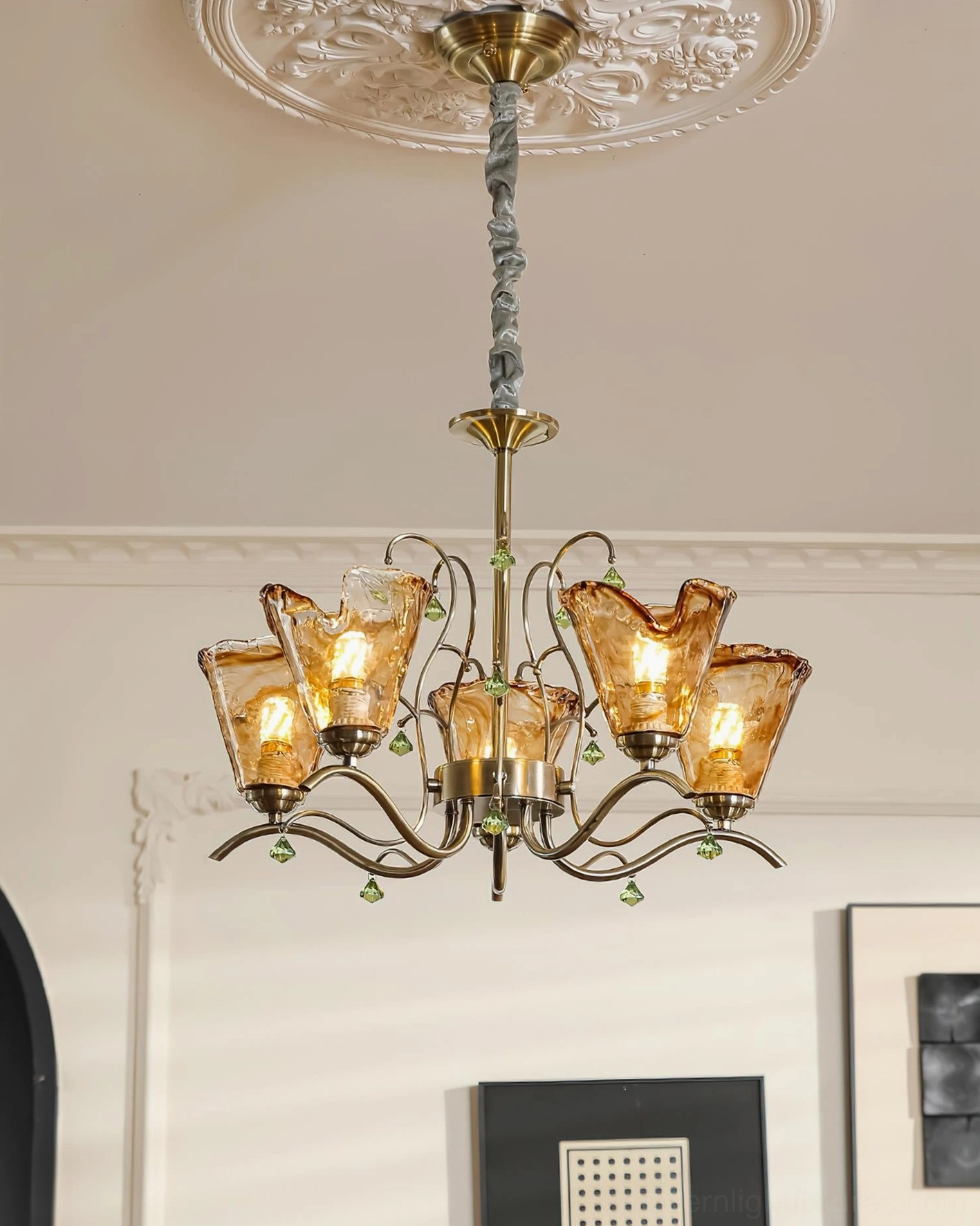 Compact 5-head Vetraio tulip glass chandelier mounted in vintage American living room, upward ceiling perspective with carved architectural details